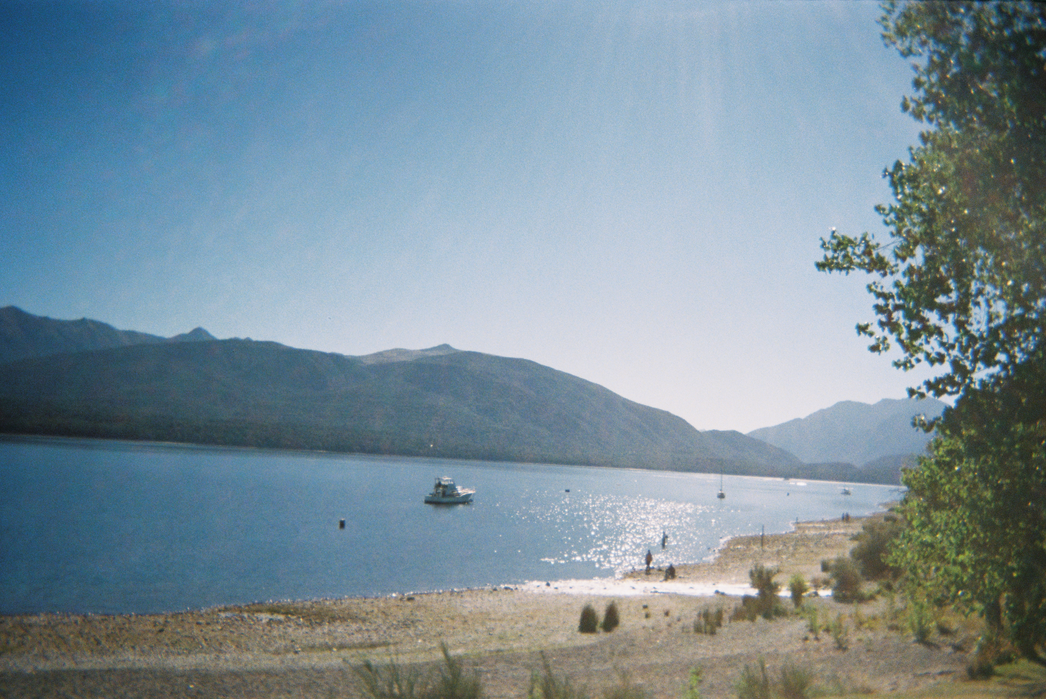 Lake with boat and mountains